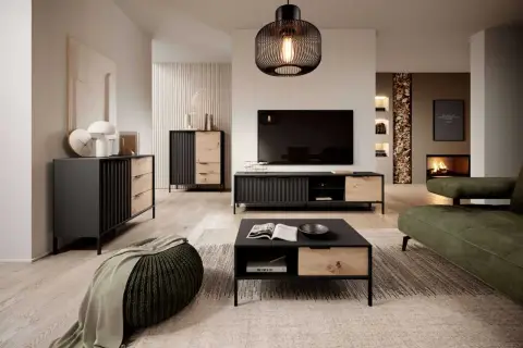 Nowoczesny salon z meblami w kolorze dąb Wotan, czerni i zieleni. Wygodna sofa, stolik kawowy i komoda tworzą przytulną przestrzeń.